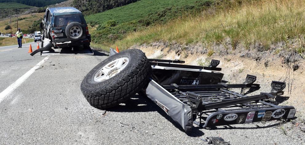 Emergency services attend a crash on the Northern Motorway, near Pigeon Flat Rd, yesterday...