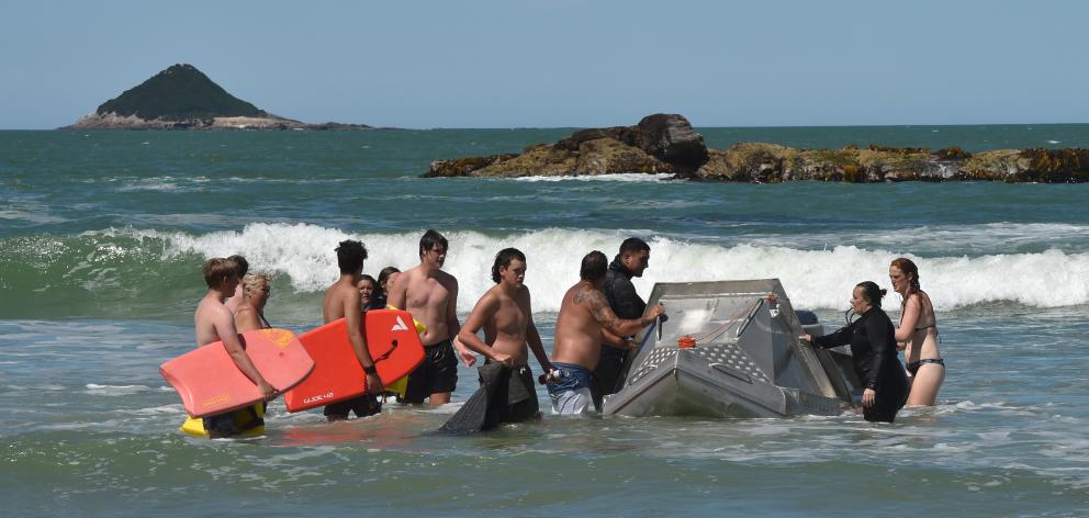 After helping a child stuck on a rock at Brighton Beach, David Daniels assisted in another...