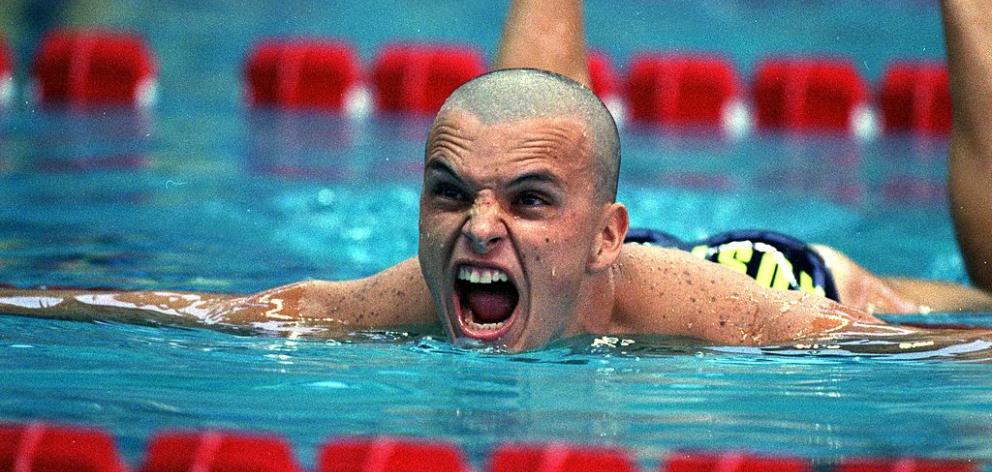 Scott Miller of Australia wins the Silver in the Mens 100 Butterfly event during the 1996 Olympic Games in Atlanta. Photo: Getty Images