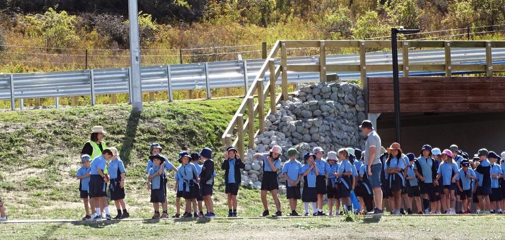Te Kura O Take Karara school teacher Caitlin Crampton leads a group of year 3 and 4 pupils ‘...