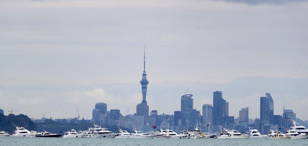 Spectator boats line the America’s Cup course in Auckland. 