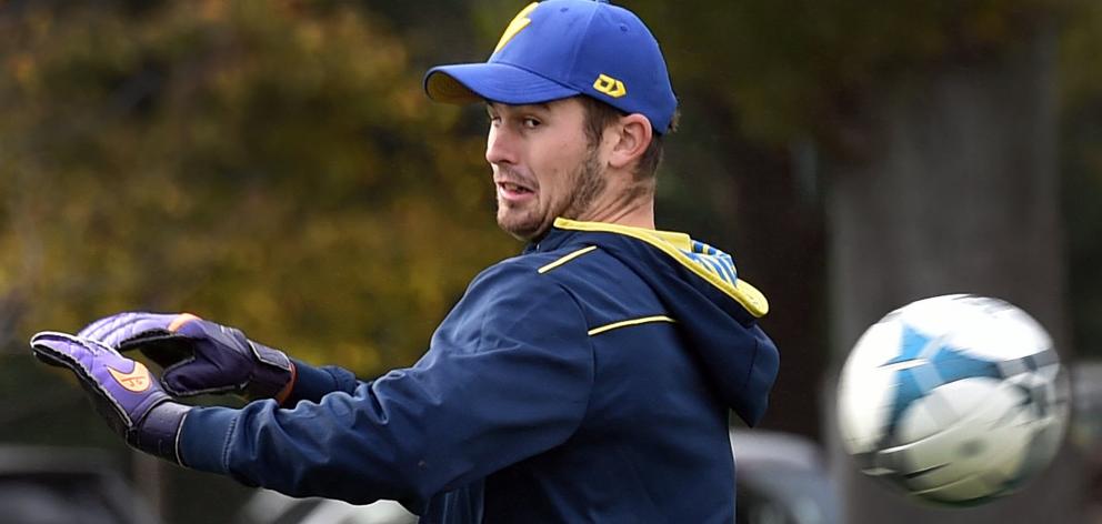 Otago seamer Jarrod McKay attempts to stop a shot during a warm-up football match at Logan Park...