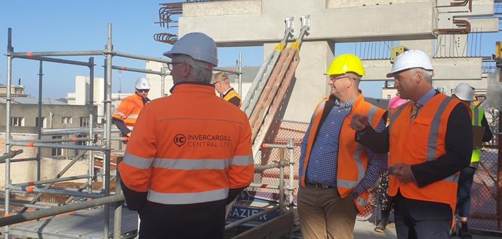 Regional Development Minister Stuart Nash reviewing progress at Invercargill's inner-city development with officials on Thursday. Photo: RNZ 