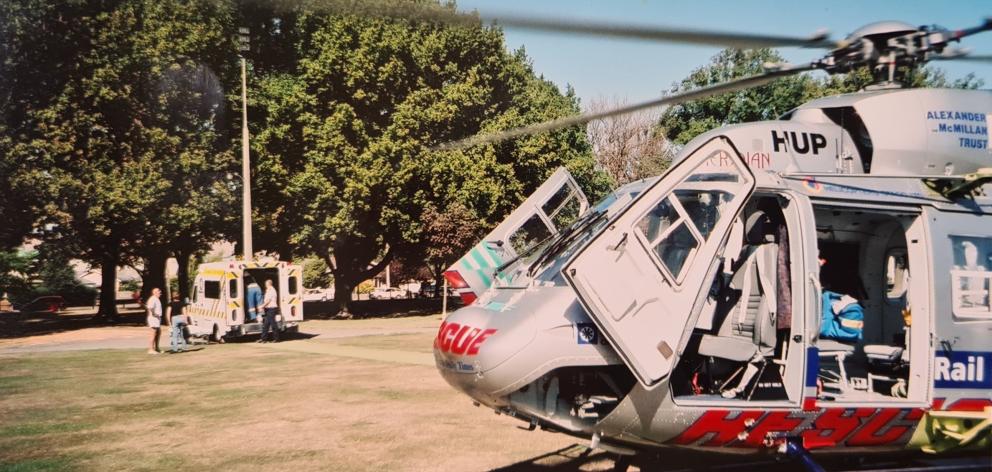 A rescue helicopter sits in Hagley Park after transporting Rob Gillan to Christchurch. PHOTO:...