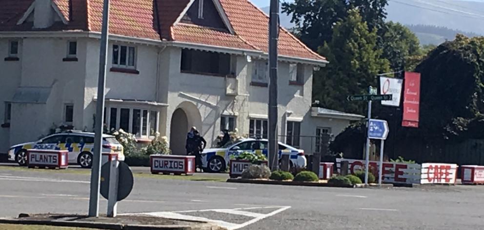 Police outside Queens Lodge this afternoon. Photo: Kayla Hodge