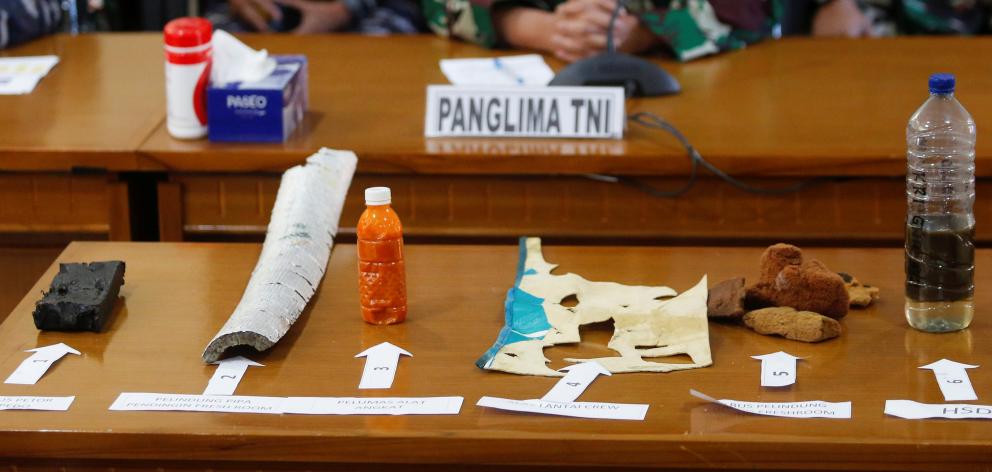 Rescuers find debris thought to be from sunken Indonesian ...