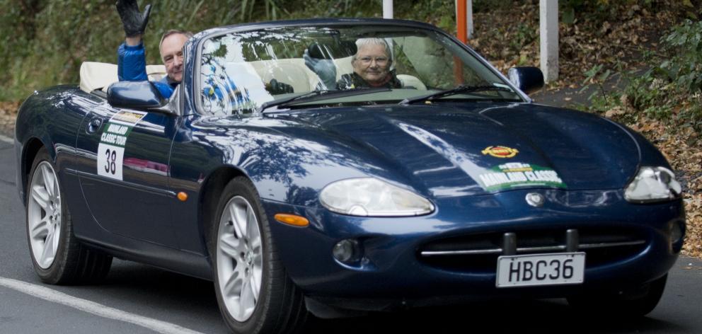 John and Wendy Gray, of Blenheim, head off with the top down in their Jaguar XK8.
