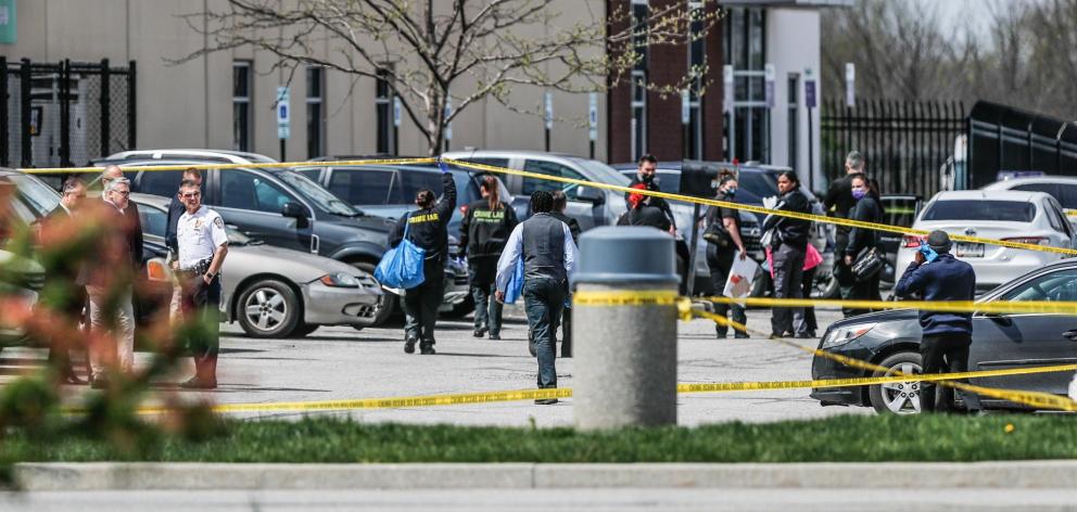 Investigators at the scene of a  mass shooting at a FedEx facility in Indianapolis. Photo: USA...