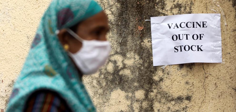 A notice about the shortage of coronavirus disease (COVID-19) vaccine supplies is seen at a vaccination centre, in Mumbai, India. Photo: Reuters