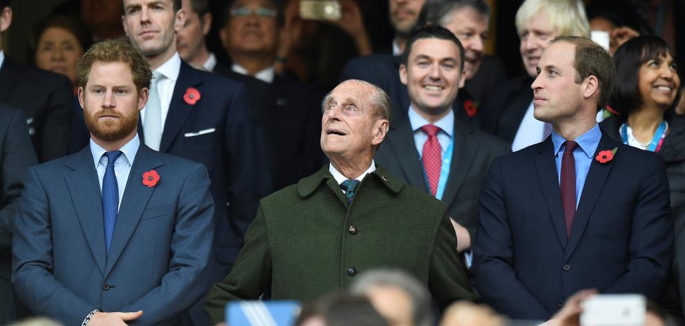 Prince Harry (left) Prince Philip and Prince William at the Rugby World Cup final match between...