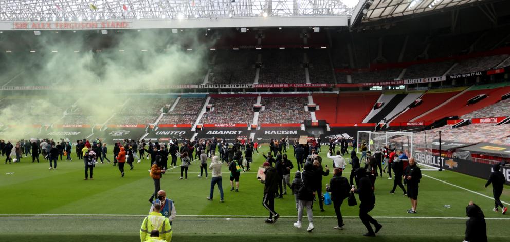 Manchester United fans protest against their owners before the Manchester United v Liverpool...