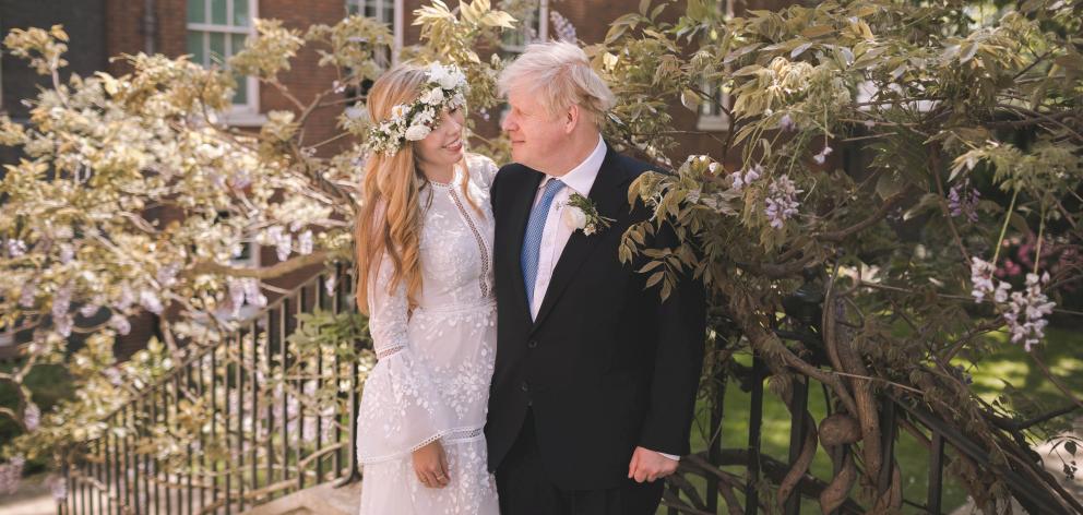 Boris and Carrie Johnson are seen in the garden of 10 Downing Street, after their wedding. Photo: Rebecca Fulton/Pool via Reuters Boris and Carrie Johnson are seen in the garden of 10 Downing Street, after their wedding. Photo: Rebecca Fulton/Pool via Reuters