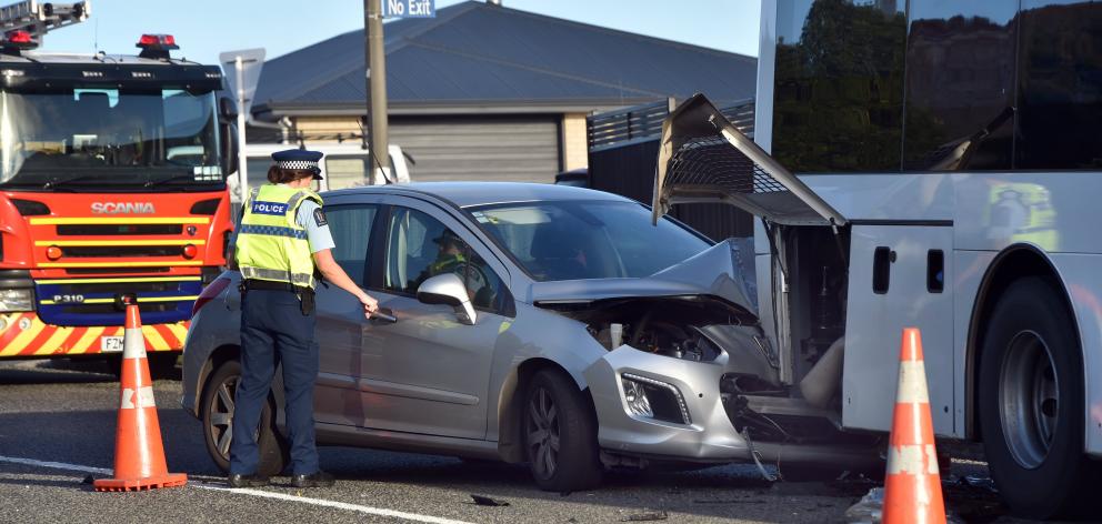 Emergency services at a crash between a car and a bus on Middleton Rd in Dunedin this morning. PHOTO: PETER MCINTOSH 