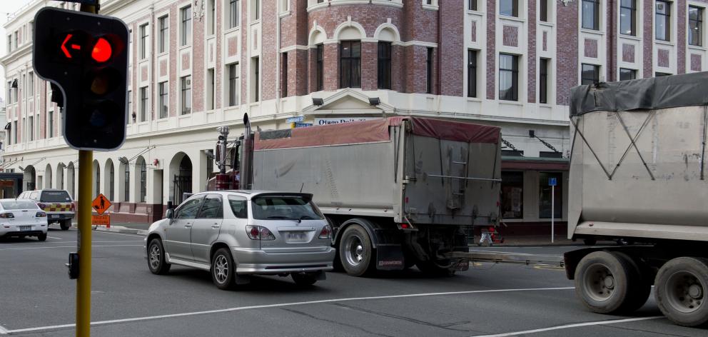 Vehicles drive through the intersection of Stuart and Cumberland Sts despite the traffic lights...