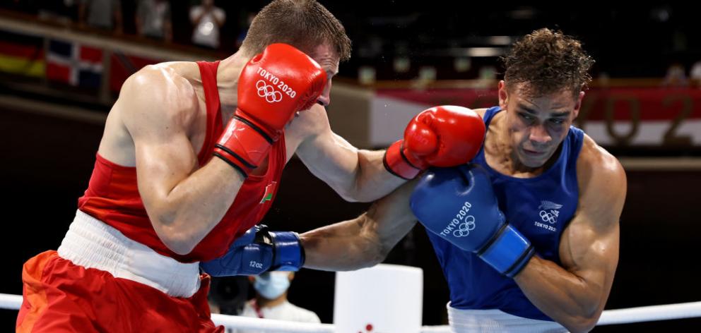 Uladzislau Smiahlikau (red) of Team Belarus exchanges punches with David Nyika who won the quarterfinal match. Photo: Getty Images