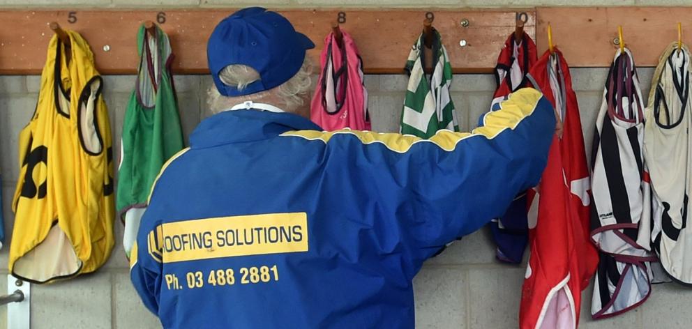 Hanging up the Lycra vests, worn by greyhounds when they race, is Otago Greyhound Racing Club...