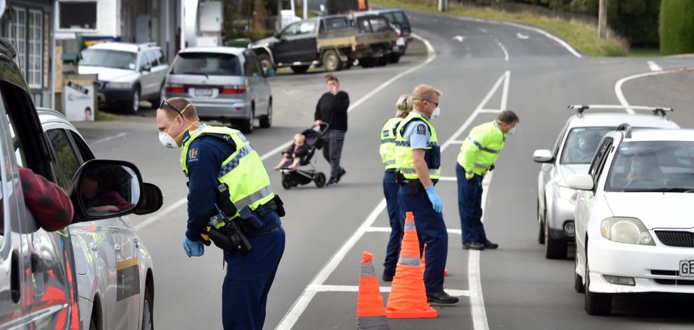 Police stop traffic in Portobello in Covid-19 Alert Level 4 yesterday. Senior Constable Aaron...