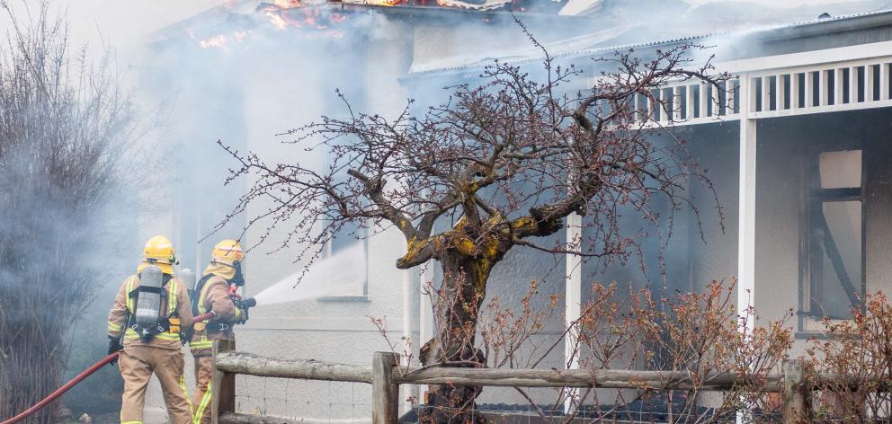Fire crews fight to keep the blaze at the The Bank Ophir bed and breakfast under control...
