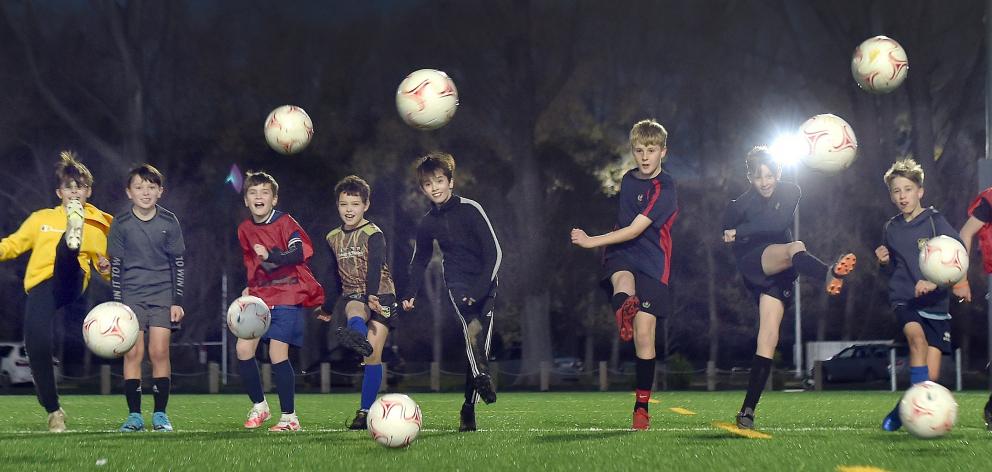 Young footballers hone their skills during a South City Royals training at Logan Park before...