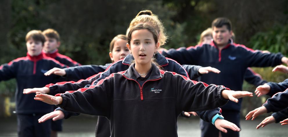Performing in a kapa haka group for the national Maori Moment at noon yesterday is Evie Pattison ...