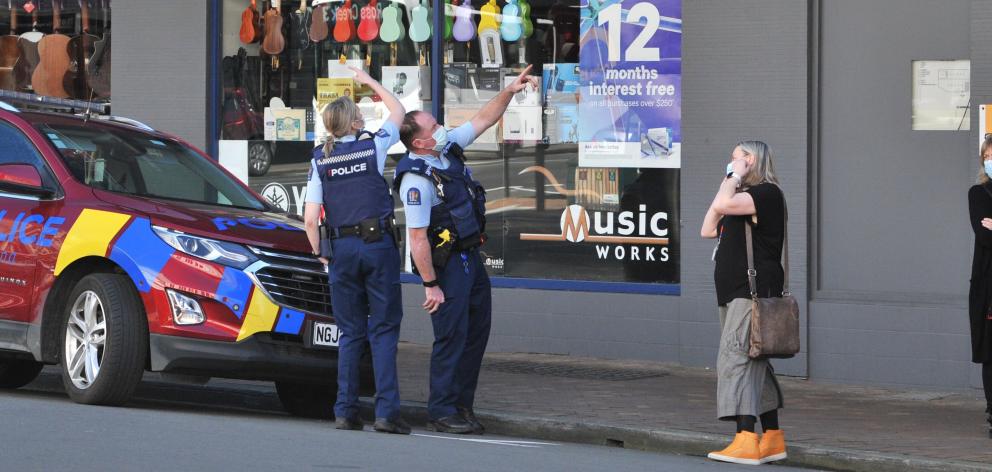 Police at the scene, outside the Department of Corrections office building, in Stuart St. Photo: Christine O'Conner