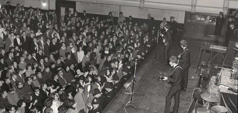 Dunedin Town Hall is filled on June 26, 1964, as the biggest band in the world, The Beatles,...