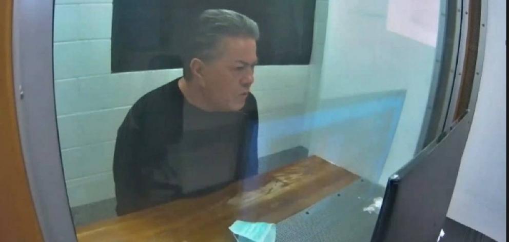 Destiny Church leader Brian Tamaki sits in a holding cell while attending his latest hearing via audio-video feed. Photo: NZME