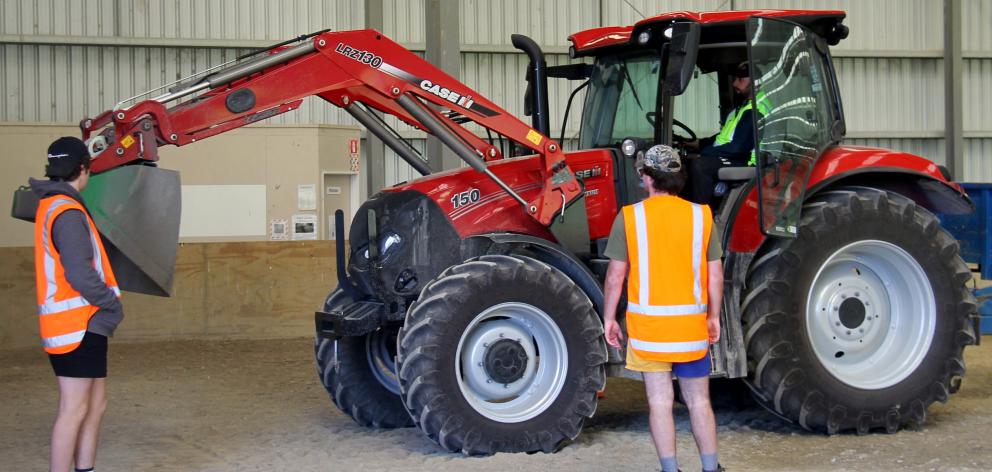 Prospective farming students get practical experience with heavy machinery. Photo: Nick Brook