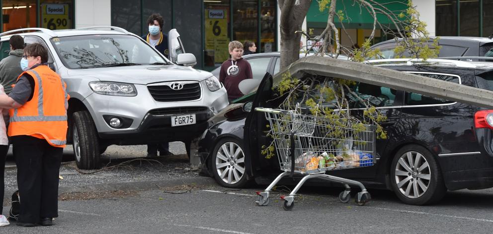 A family had a narrow escape after a light pole crashed on to their vehicle after it was hit by...