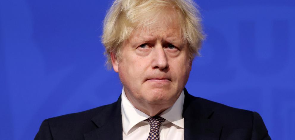 Britain's Prime Minister Boris Johnson speaks during a press conference on the new Omicron...