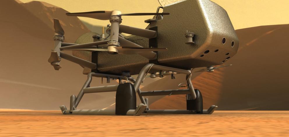 The Dragonfly drone will explore dozens of locations across Titan, sampling and measuring the compositions of the moon’s organic surface materials. PHOTO: NASA/JOHNS HOPKINS APL