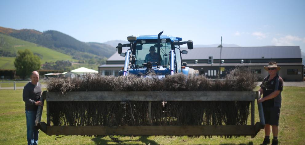 The show goes on ... Setting up for tomorrow’s showjumping are (from left) Southern Canterbury A...