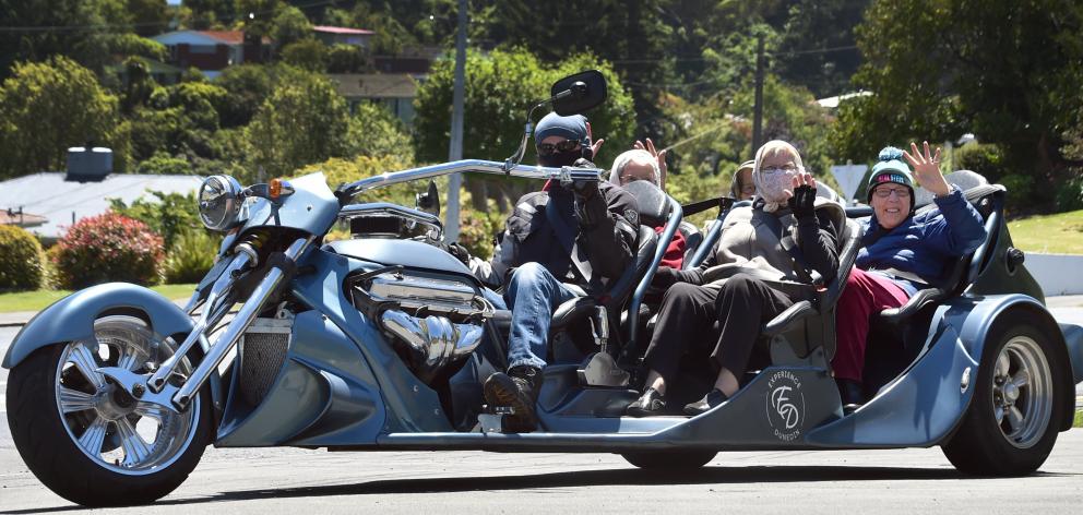Powering around the suburbs of Dunedin are (from left) driver Murray McKenzie, Shirley Erwin,...