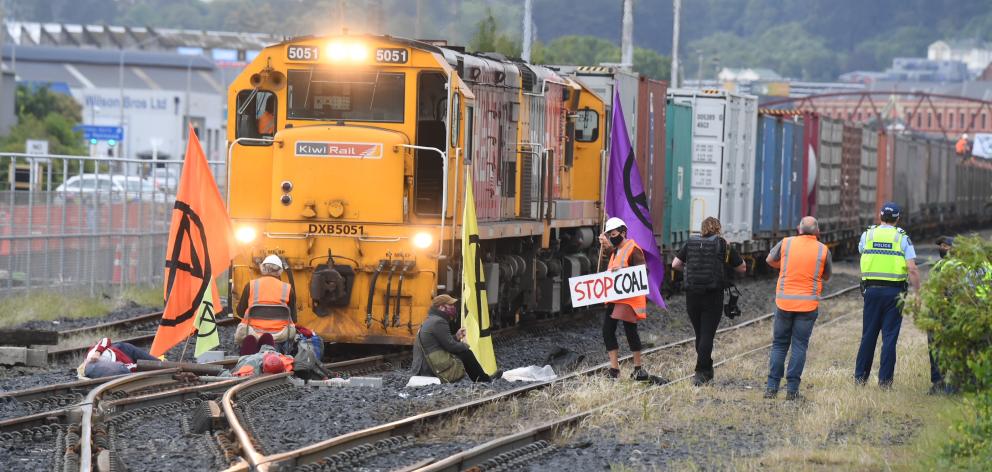 Members of the group Extinction Rebellion block a coal carrying train at the station. PHOTO:...