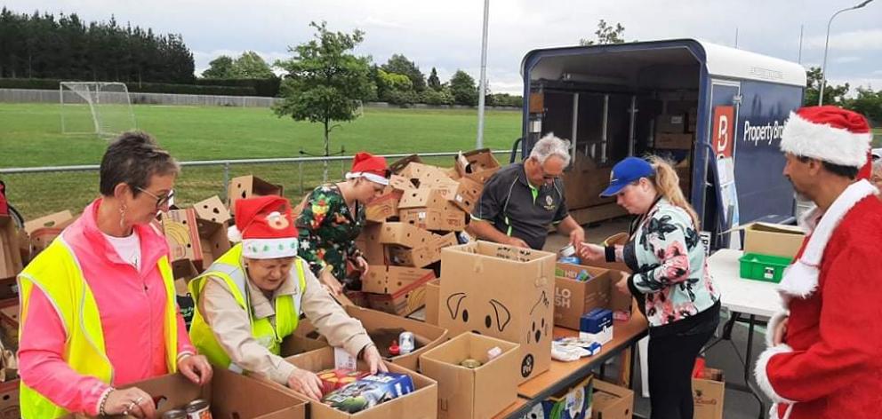 Volunteers sort through the collected items. Photo: Supplied