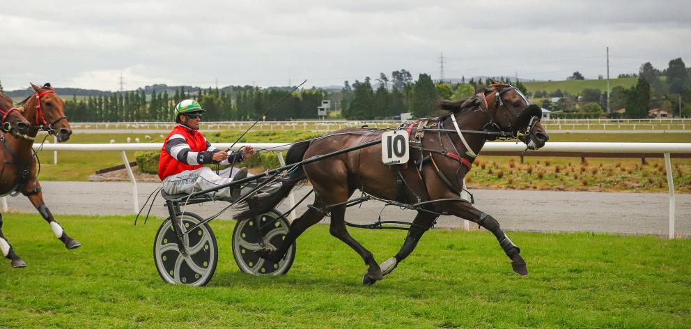 Johnny Mac wins the Gore Cup yesterday for driver Blair Orange and trainer Michael House. PHOTO:...