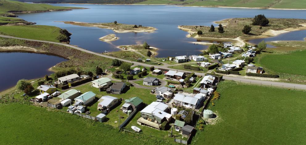 The village on the banks of Lake Mahinerangi consists of holiday homes or cribs. Photo: Stephen...