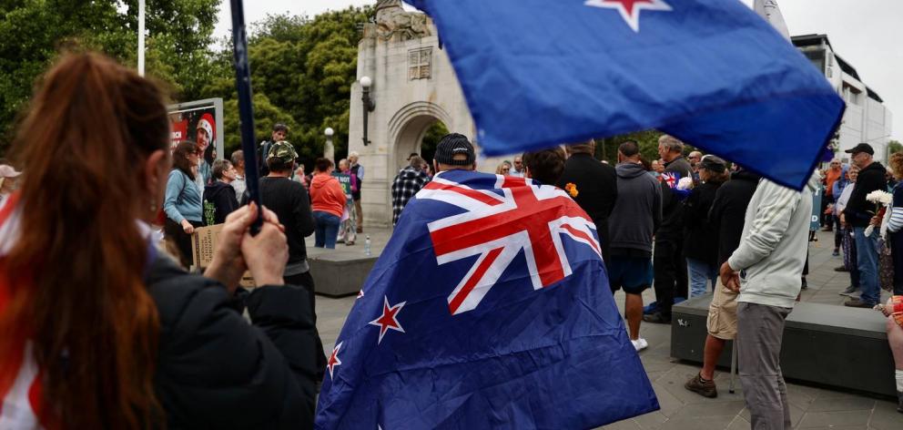 Hundreds of people gathered in silence at Christchurch's Bridge of Remembrance today "to mark the...