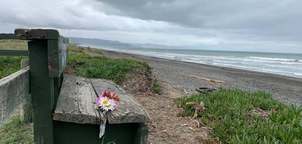 Flowers have been left at Leithfield Beach where human remains have been found. Photo: Kurt Bayer Flowers have been left at Leithfield Beach where human remains have been found. Photo: Kurt Bayer