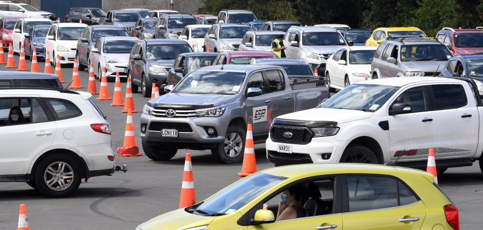 Cars queue at Te Kaika drive-in vaccination centre in Victoria Rd, Dunedin, yesterday. PHOTO:...