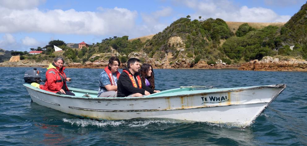 Meghan Hughes (left) and her family Arlo (14), Gareth and Zoe (11) Hughes travel by boat on Otago...