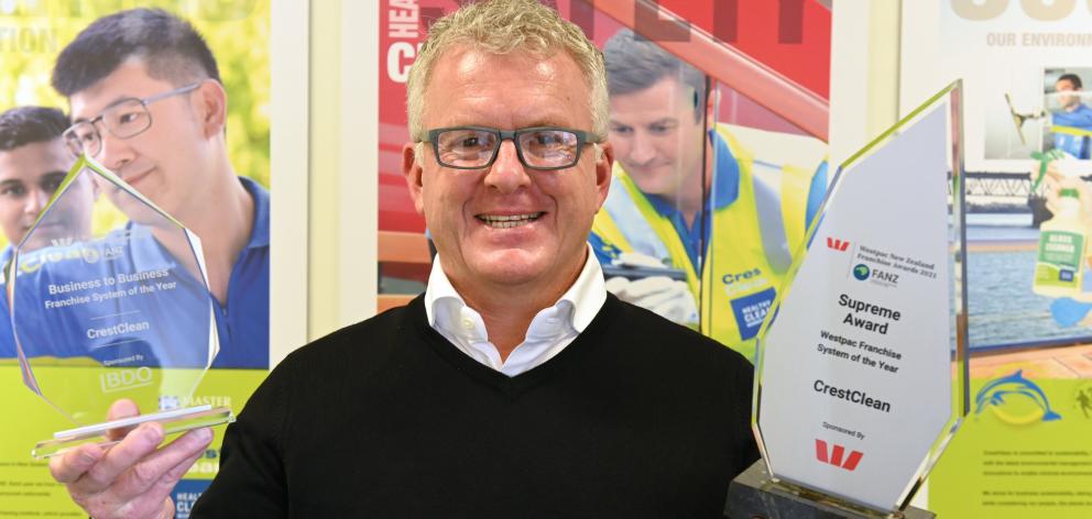 CrestClean managing director and co-founder Grant McLauchlan holds the company’s recent awards....