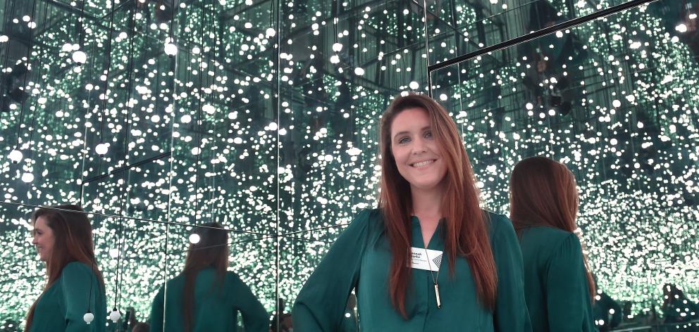 Otago Museum’s new science centre manager Hannah Rourke immerses herself in the glow of one of...