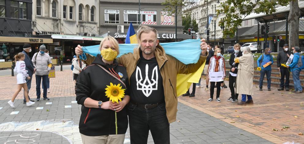 Backing their home country are Olha Viazenko and her husband, Oleksii Ikonnikov, who came to...