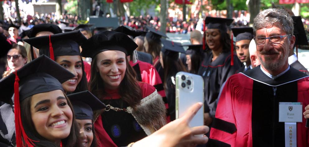 Jacinda Ardern with graduating students at Harvard. Photo: Reuters 