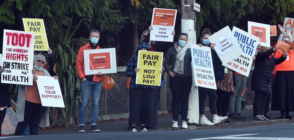 Passing motorists were encouraged to show support with their car horns for striking workers...