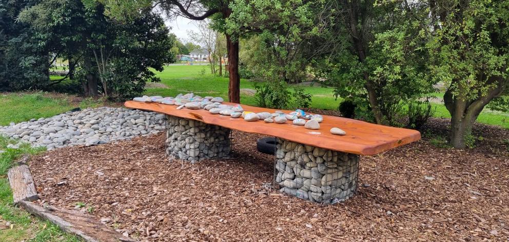 The tabletop made from macrocarpa was used as a "shared kai" table by the children. Photo: Supplied