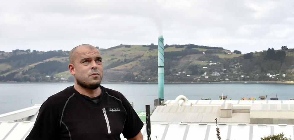 Jacob Parker stands outside his home as the Ravensdown Dunedin works, the site of a large...
