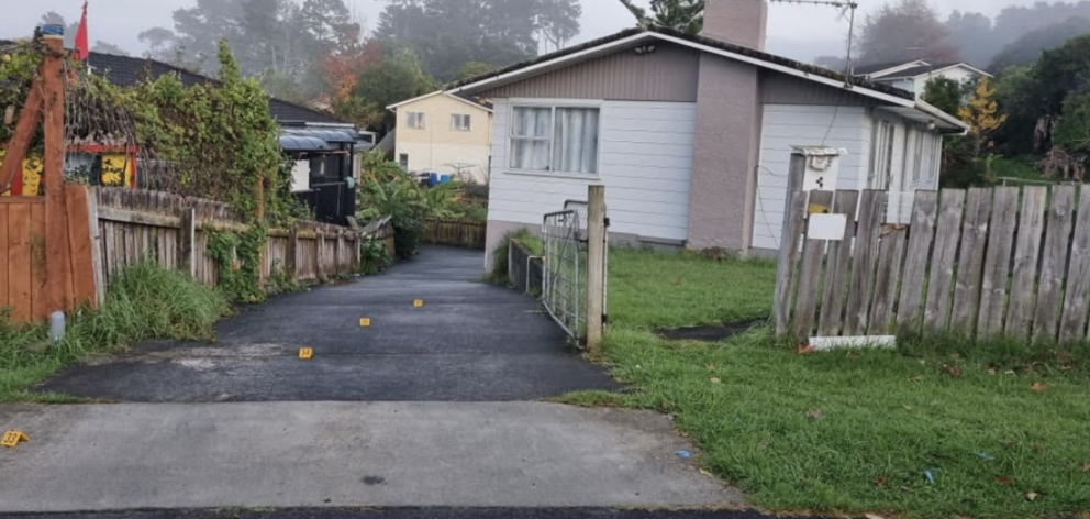 Markers on a driveway after a shooting in Vina Place, Massey. Photo: RNZ