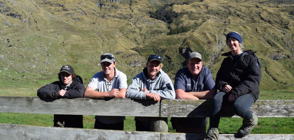 At the foot of Niger Peak on Matukituki Station are station manager James Stewart (fourth from...